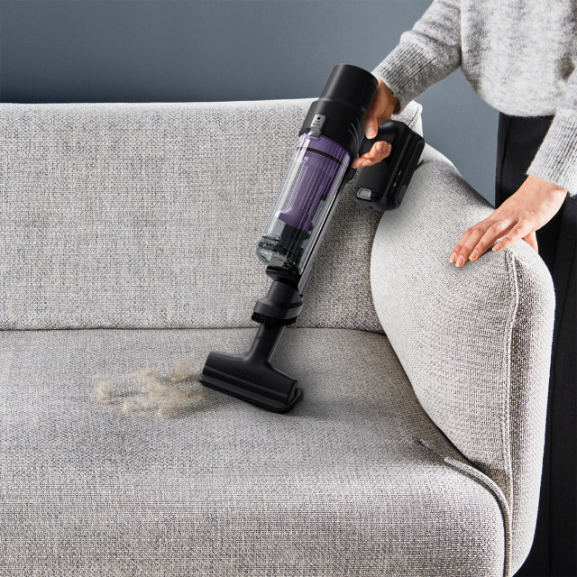 Rowenta 7.60 Cordless Stick Cleaner X-Pert Force Vacuum Cleaner on the sofa