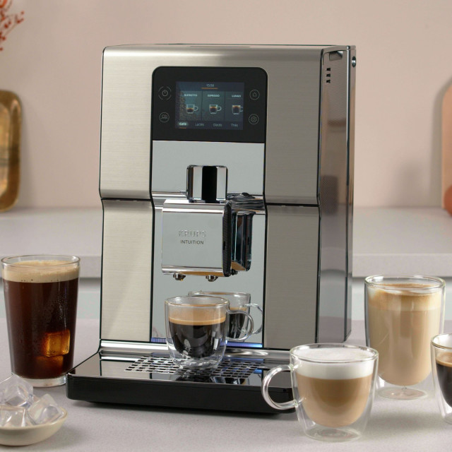 Krups Intuition Experience+ Bean-To-Cup Coffee Machine on the kitchen counter with cups of coffee