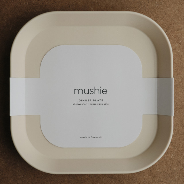 Mushie Square Dinner Plate - Ivory on the table