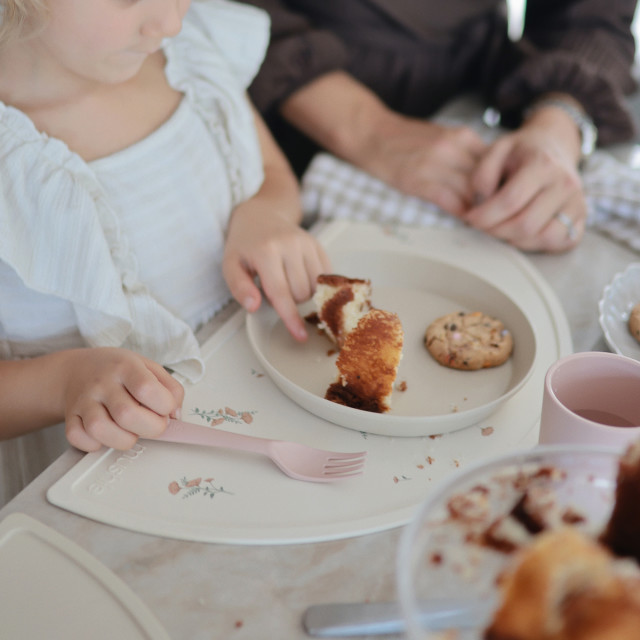 Mushie Silicone Placemat - Pink Flowers on the table