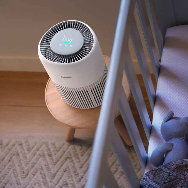 Philips Series 900 PureProtect Mini Air Purifier in a bedroom