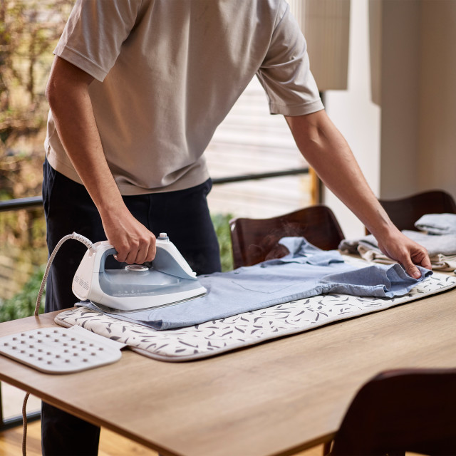 Joseph Joseph Swift Ironing Mat - Ecru Scatter on the table