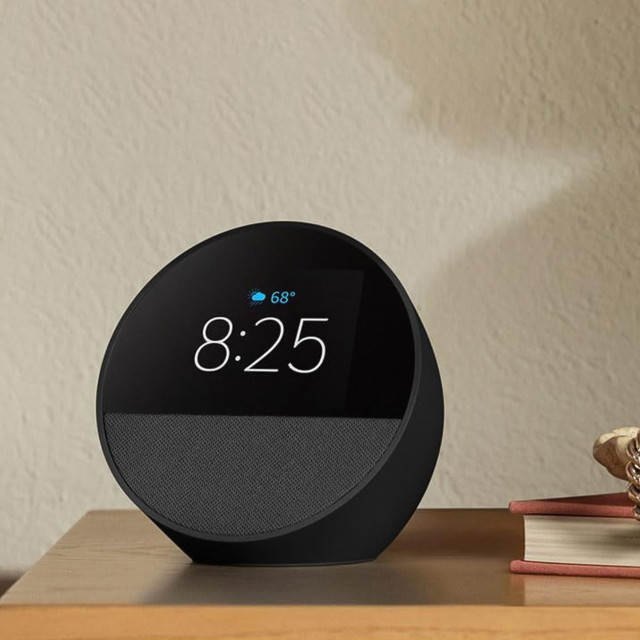 Amazon Echo Spot Smart Alarm Clock With Alexa - Black on the table
