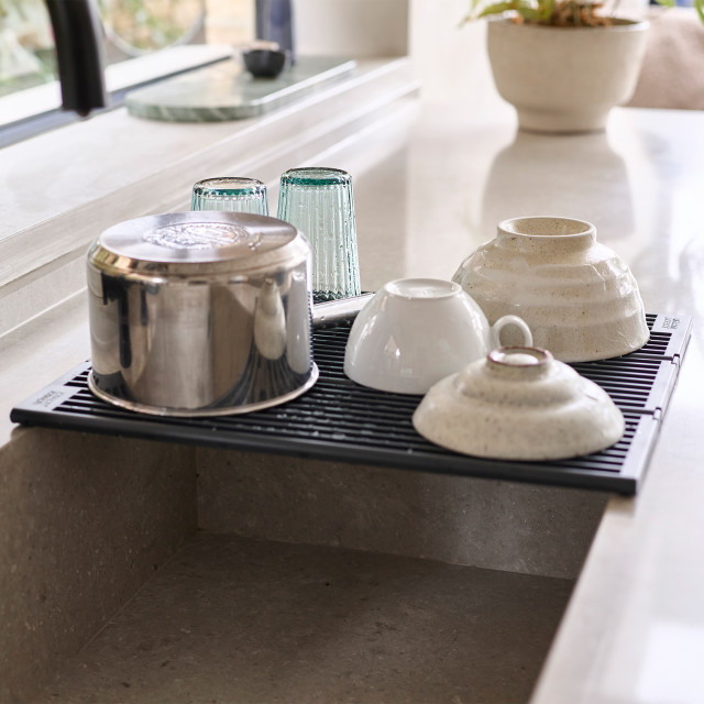Joseph Joseph Platform Foldable Over-Sink Drainer with dishes