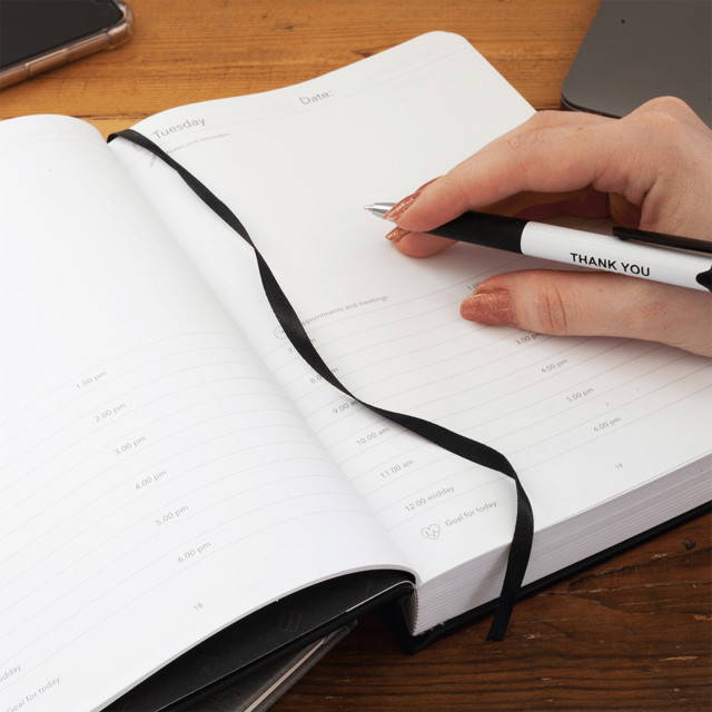 The Papery Classic Multi-Planner - Black on the table
