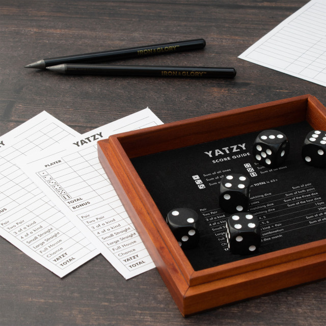 Suck UK Iron & Glory Wooden Yatzy Dice Game on the table