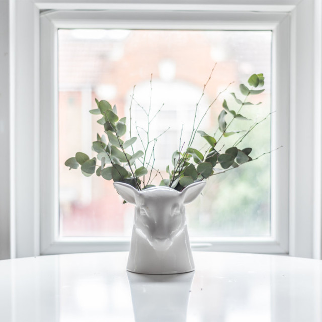 Suck UK Stag Tidy Cermaic Utensil Holder with plants on the table