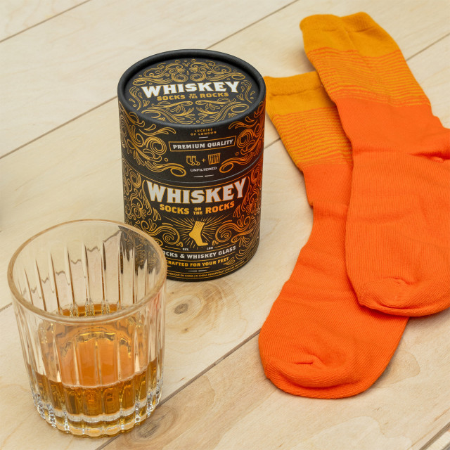 Suck UK Whiskey Socks on the Rocks Gift Set on the table wih socks