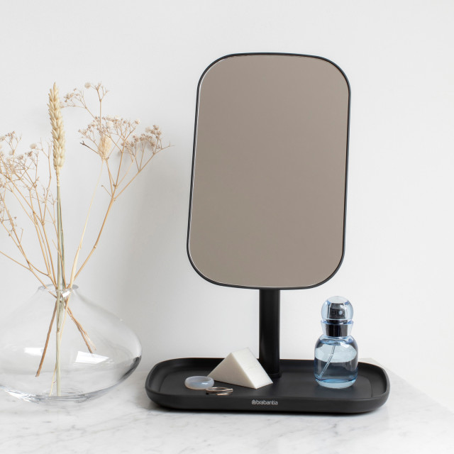 Brabantia ReNew Mirror with Storage Tray - Dark Grey with a bottle of perfume