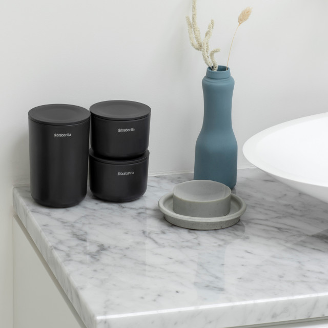 Brabantia ReNew Storage Pots, Set of 3 - Dark Grey next to the basin