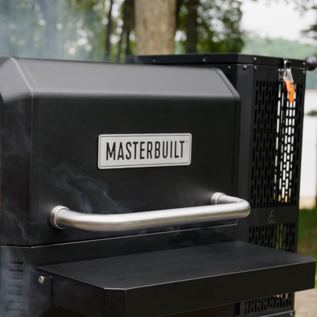 Masterbuilt Gravity Series 600 Charcoal Grill & Smoker closed with smoke
