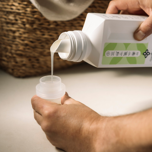 GoodBasics Probiotic Laundry Liquid, 1L poured in the lid