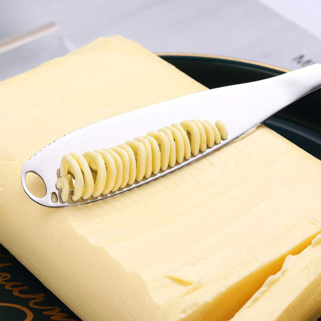 Creative Cooking Butter Knife with Spreader, 20.5cm on a block of butter