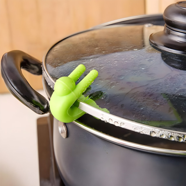 Creative Cooking Pot Lid Lifters, Set of 3 on a pot
