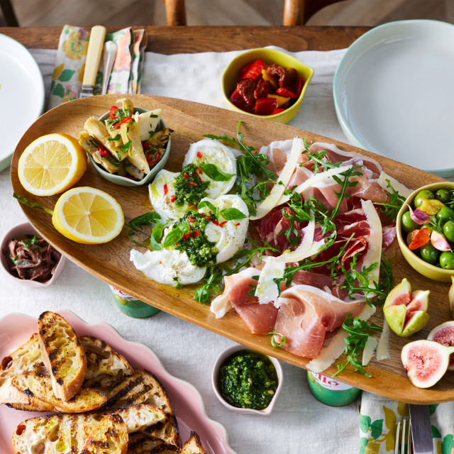 Jamie Oliver Big Love Mango Wood Board, 57cm on the table with food