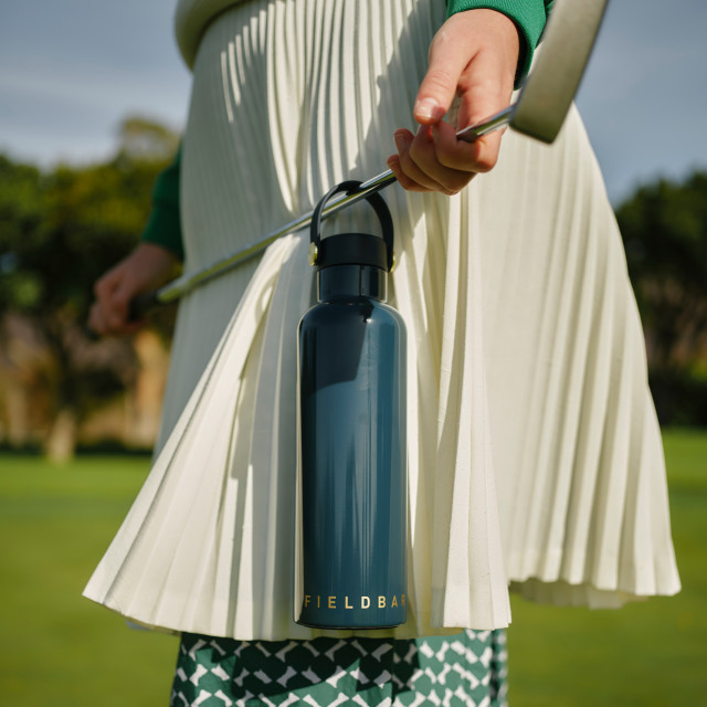 Fieldbar Signature Shades Collection Field Bottle, 750ml - Sea Boat Blue hanging on a golf stick