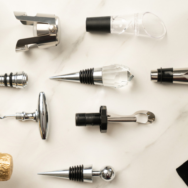 Dalton & Turner Wine Aerator Pourer on the table with stoppers