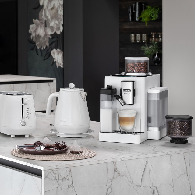 DeLonghi Rivelia Bean to Cup Coffee Machine with Bean Switch - Arctic White with a kettle and a toaster