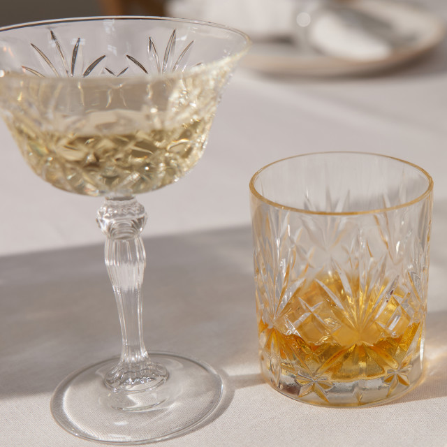 Lyngby Melodia Crystal Champagne Coupe Glasses, Set of 4 with champagne on the table