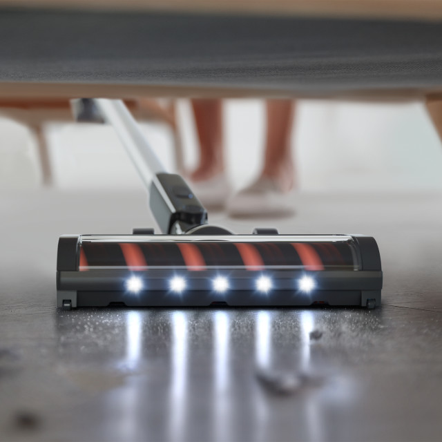 Philips 3000 Series Cordless Stick Vacuum under a couch