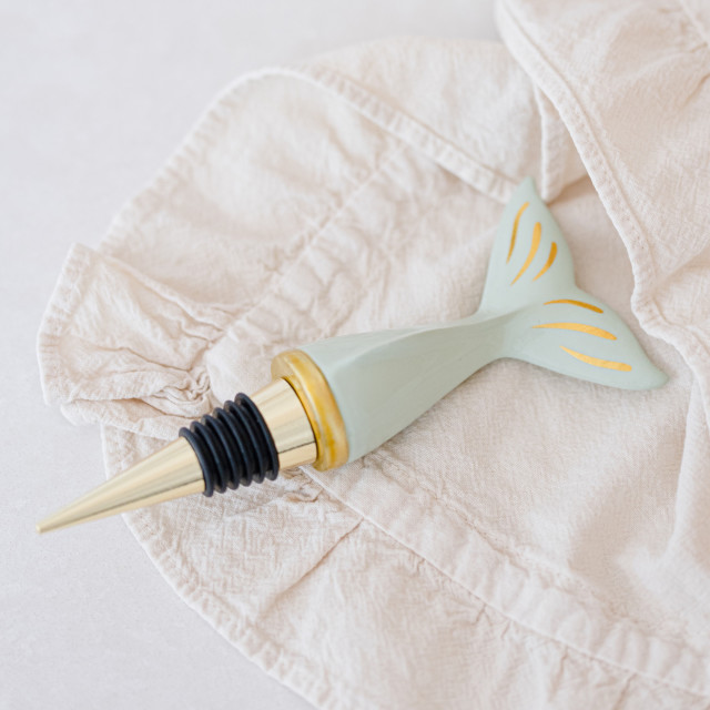 Yvonne Ellen Whale Bottle Stopper on a cloth