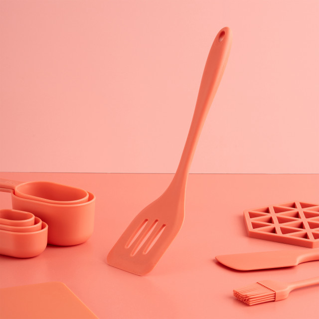 Fusion Twist Silicone Slotted Turner - Coral on the table