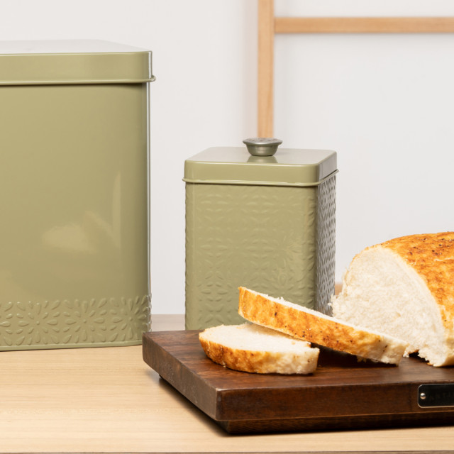 Artisan Street Embossed Storage Canister - Green on the counter with sliced bread