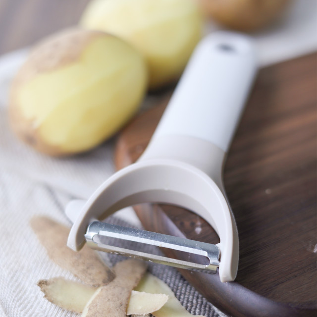 Kitchen Inspire Y-Shaped Peeler with peeled potatoes
