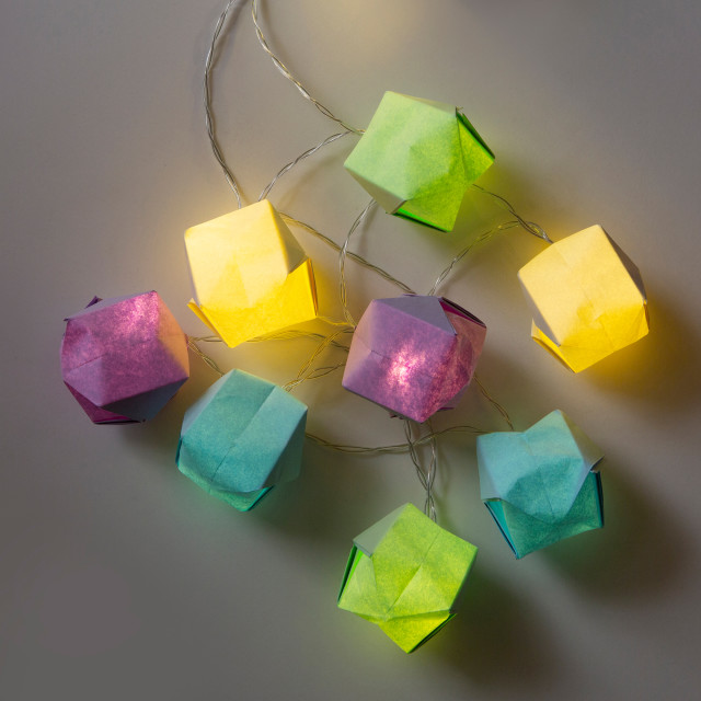 Kikkerland Make Your Own String Lights DIY Kit lit on the table