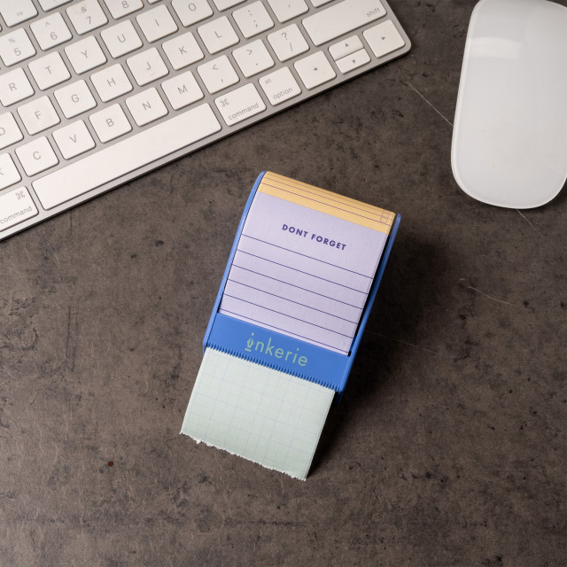 Kikkerland Sticky Note Dispenser on a desk