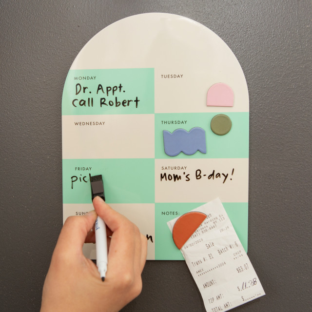 Kikkerland Magnetic Weekly Memo Board on a fridge