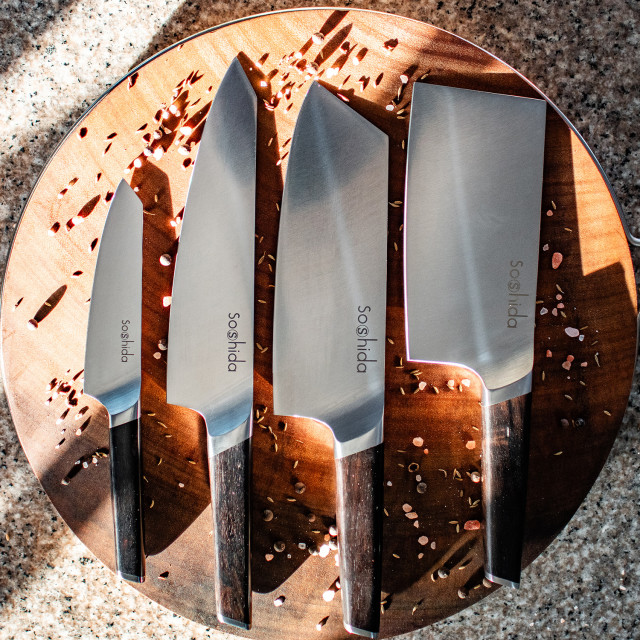 Soshida Supreme Chef Knife Set, 4-Piece on a chopping board