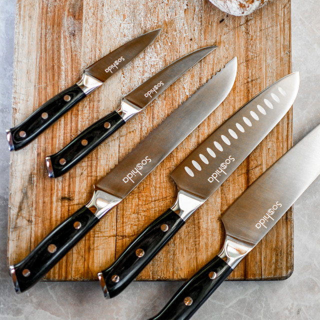 Soshida Ultra Chef Knife Set, 5-Piece on a chopping board