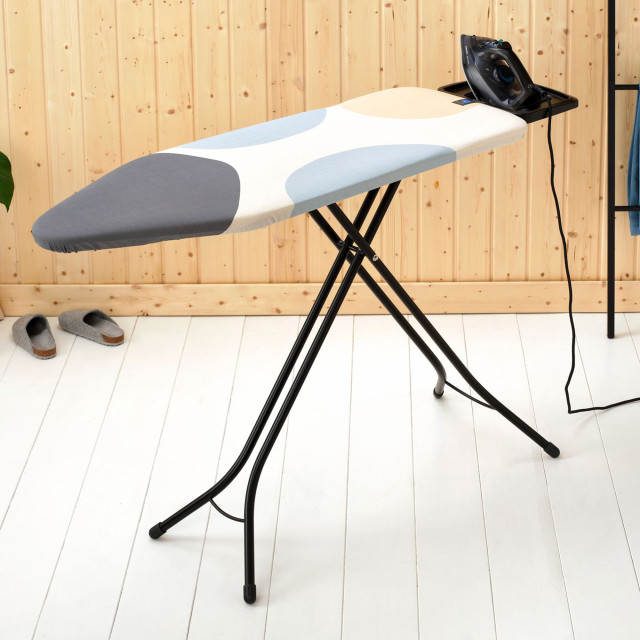 Brabantia Spring Bubble Ironing Board with Solid Steam Iron Rest, 124cm x 45cm with an iron