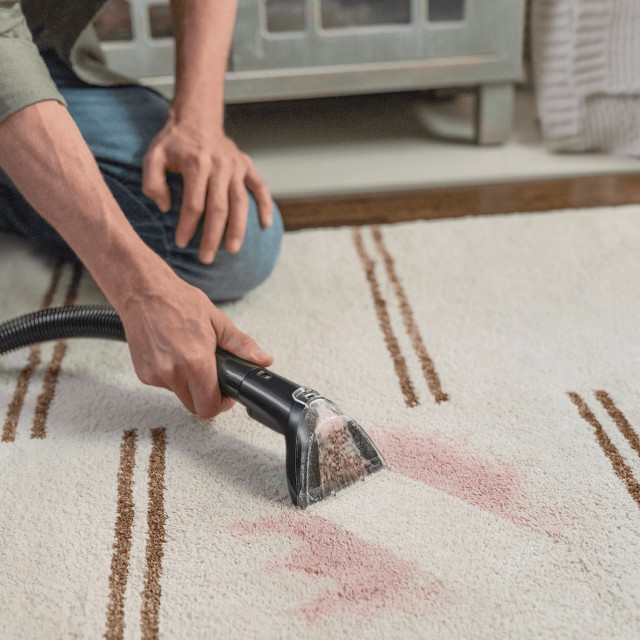 Bissell SpotClean TruHeat Cleaner on a rug
