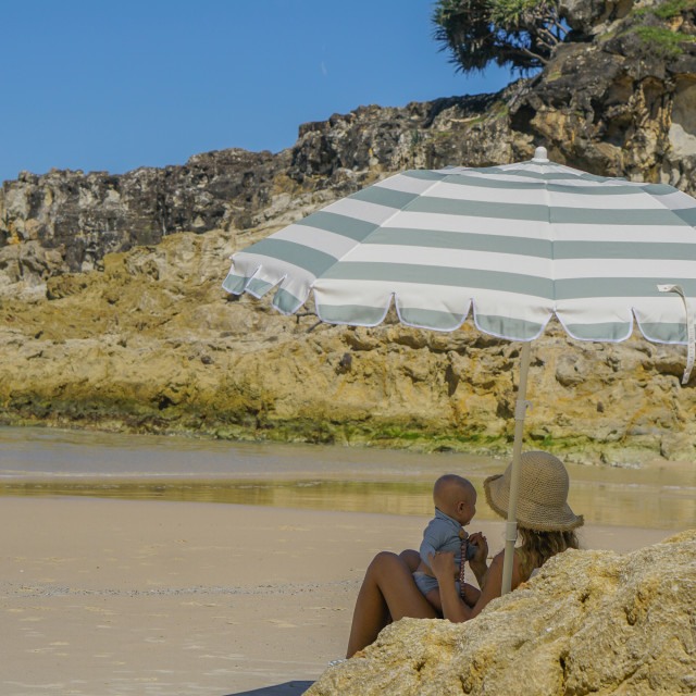 Sunnylife Compact Beach Umbrella - La Palma Sage Stripe at the beach