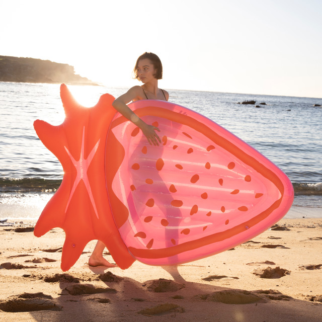 Sunnylife Luxe Lie-On Float - Strawberry Pink at the beach