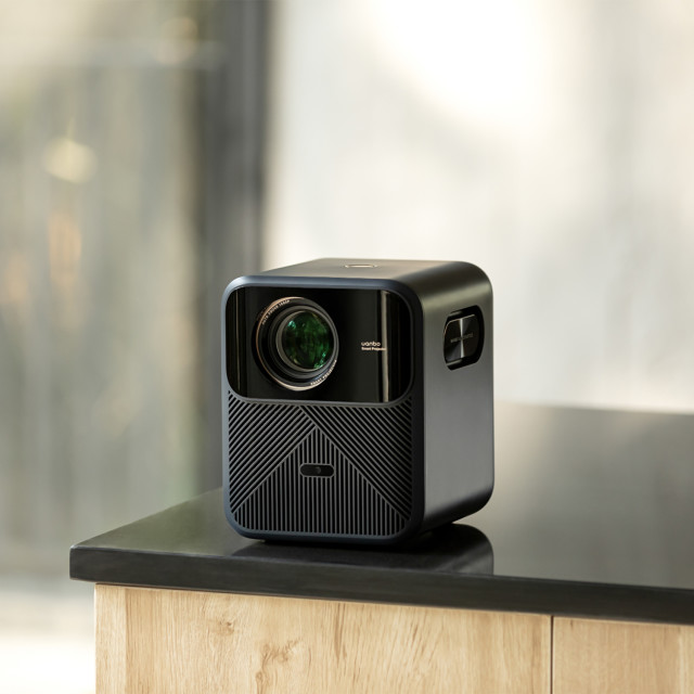 Wanbo Mozart 1 Pro Smart Home Theatre Projector, 1080p on the table