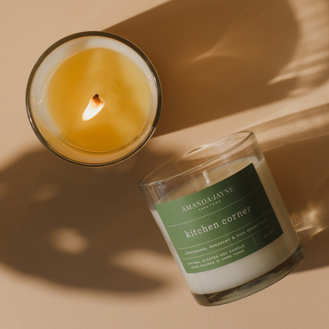Amanda Jayne Kitchen Corner Lemongrass, Rosemary & Pink Grapefruit Glass Candle, 220g on the table