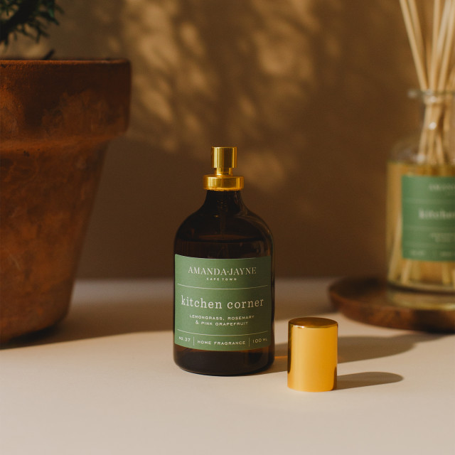 Amanda Jayne Kitchen Corner Lemongrass, Rosemary & Pink Grapefruit Home Fragrance, 100ml opened on the table