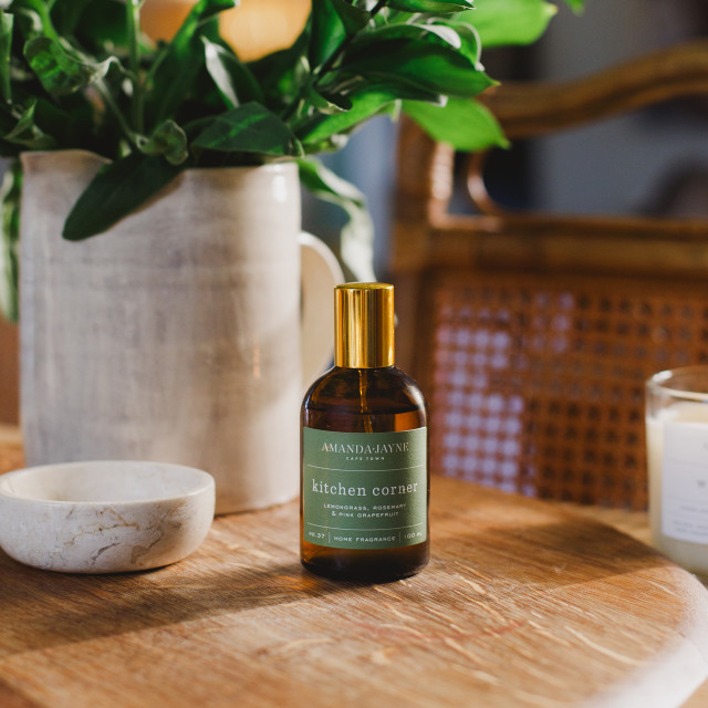 Amanda Jayne Kitchen Corner Lemongrass, Rosemary & Pink Grapefruit Home Fragrance, 100ml on the table