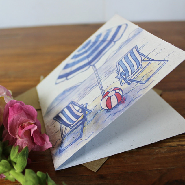 Growing Paper Beach Day Greeting Card opened on the table