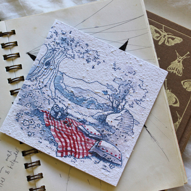 Growing Paper Picnic Greeting Card on a bok showing scale