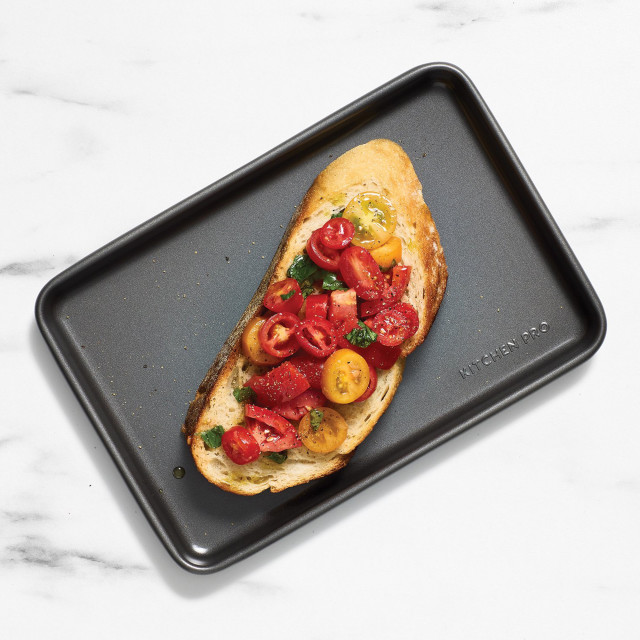Kitchen Pro Bakewell Baking Tray - 25cm x 17cm with bread and tomatoes