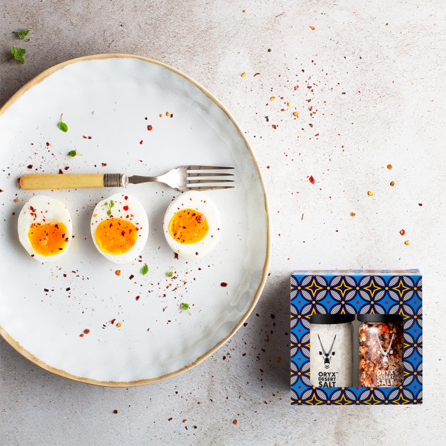 Oryx Desert Salt Desert Salt & Chilli Salt Grinders, Set of 2 on the table with eggs