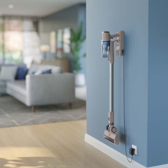 Philips 2000 Series Cordless Vacuum hung on a wall charging
