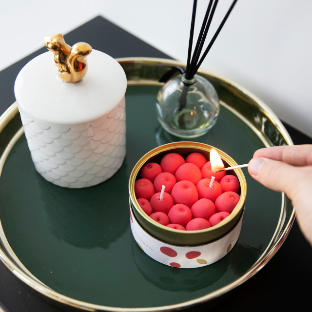 CandleCan Fruity Cherry Scented Candle on a side table
