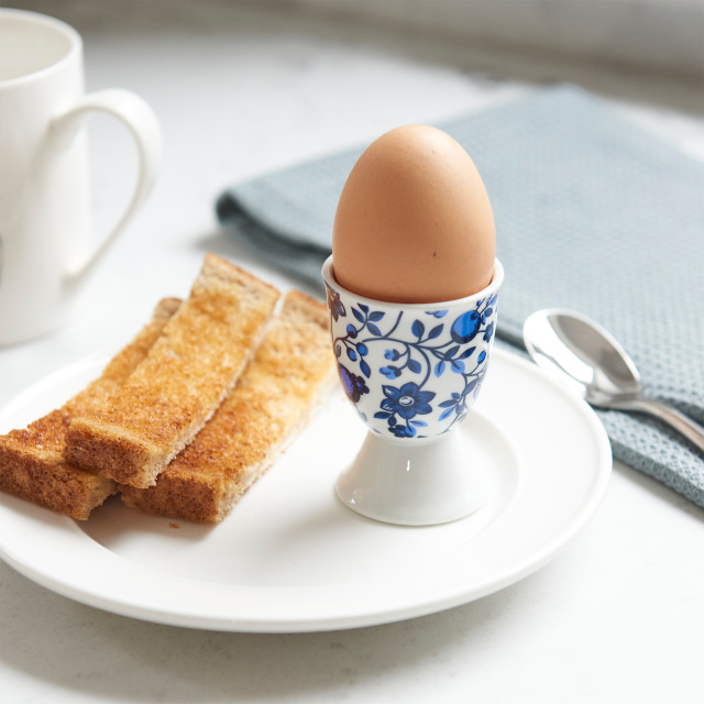 KitchenCraft Traditional Porcelain Hen Egg Cup on a plate