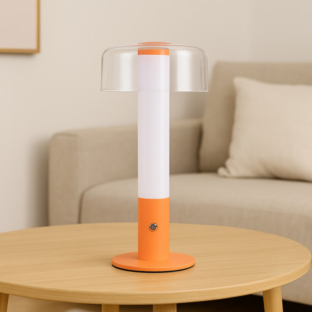 Arc & Hue Arcis Portable & Rechargeable LED Lamp - Orange on a coffee table