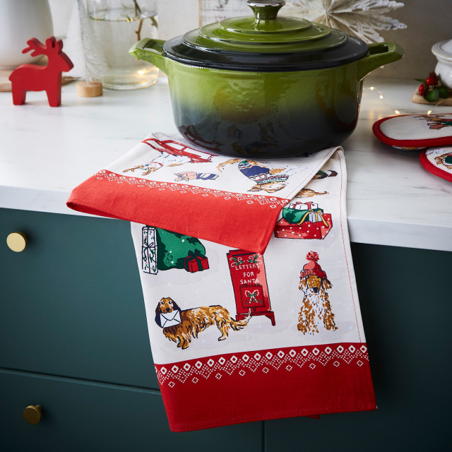 Ulster Weavers Merry Mutts Cotton Tea Towel on the table with a pot
